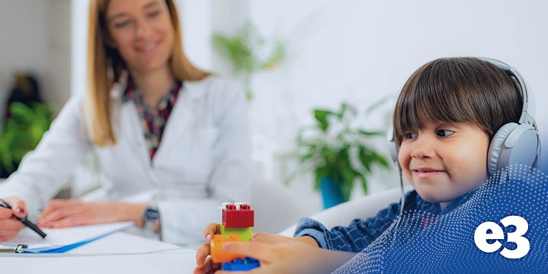 Pediatric Audiologist Testing Hearing with a Little Boy