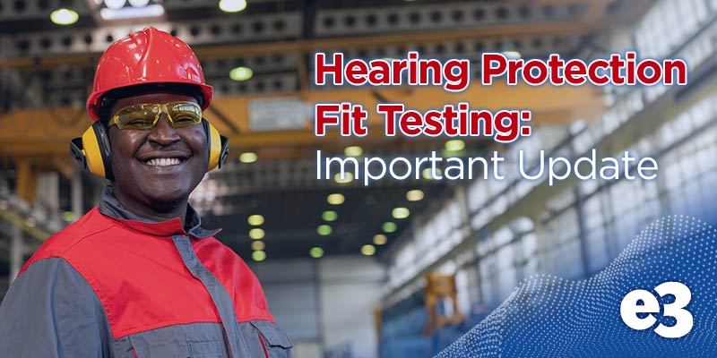 African American working in factory with hearing protection on