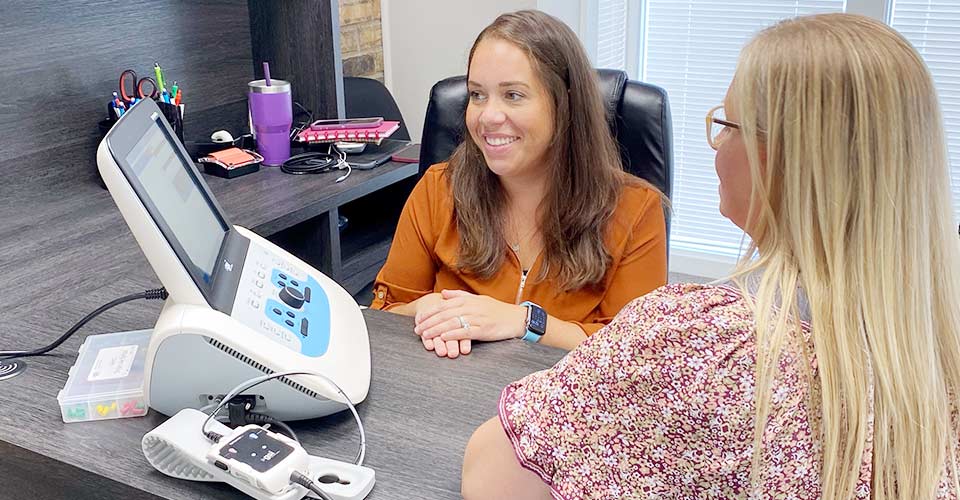 Casey Tusa testing patients hearing