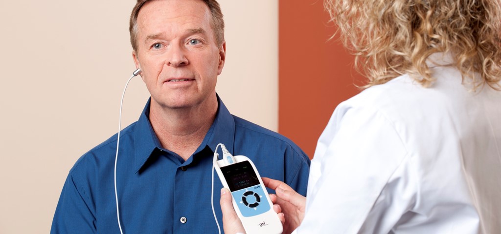 An audiologist using the GSI Corti for OAE testing