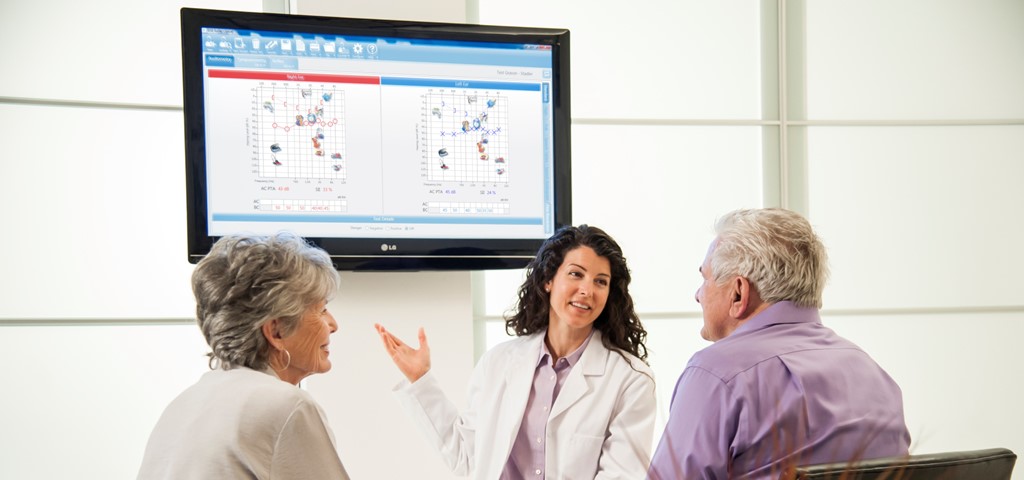 An audiologist explaining audiometric testing results to patients