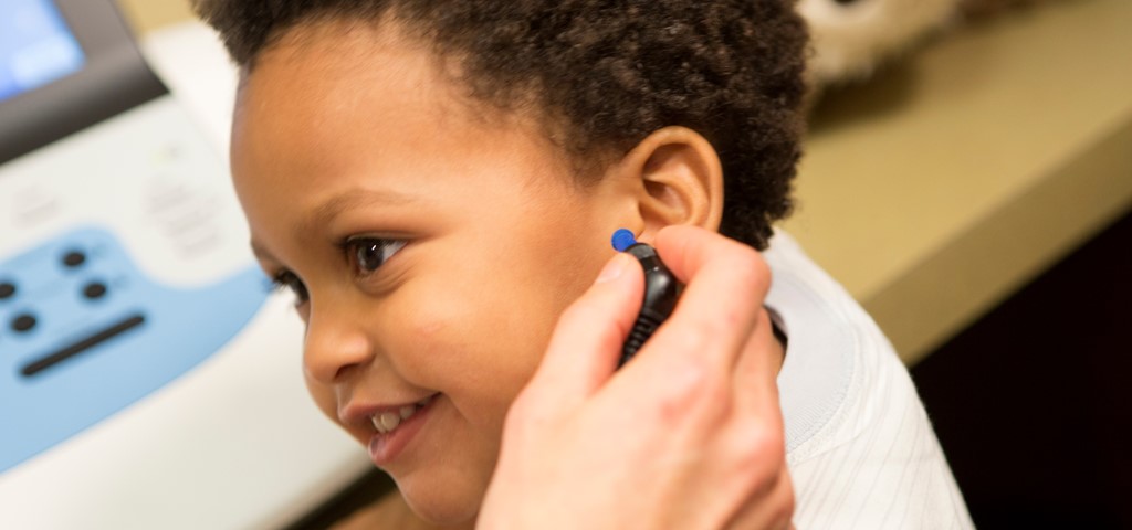 Tympanometry testing on a child