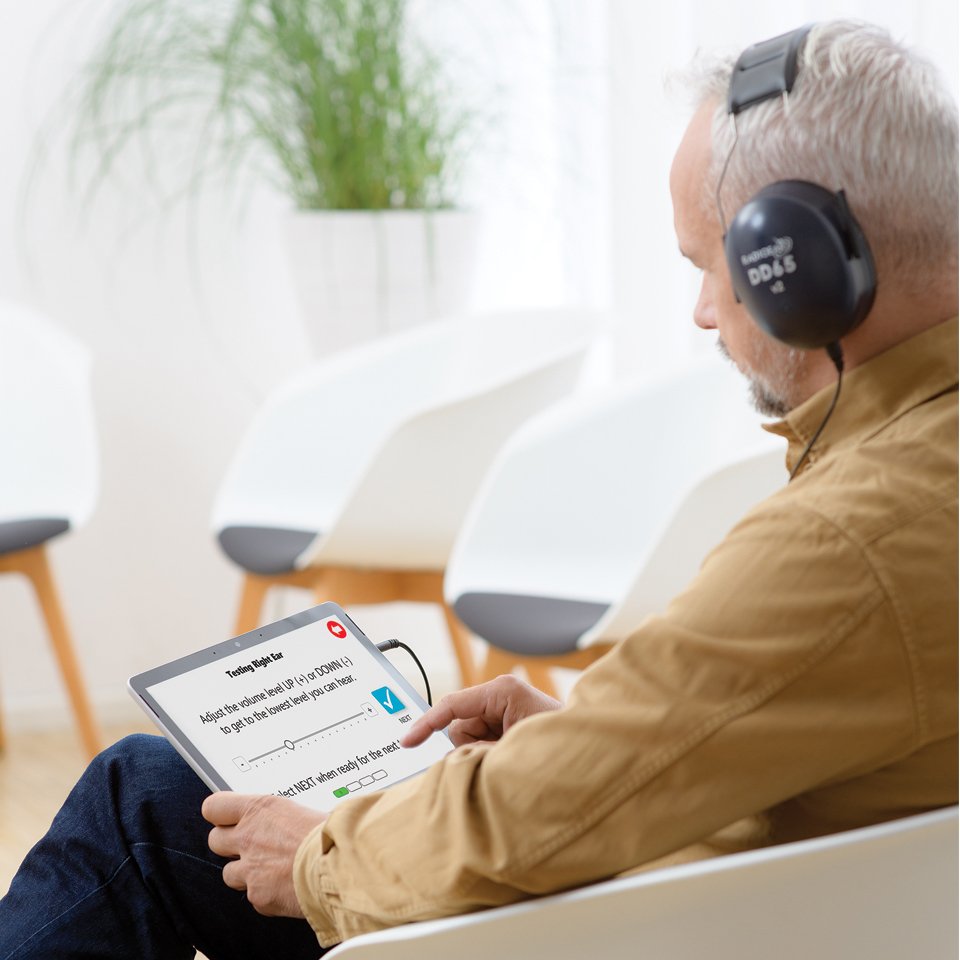 man-taking-hearing-test