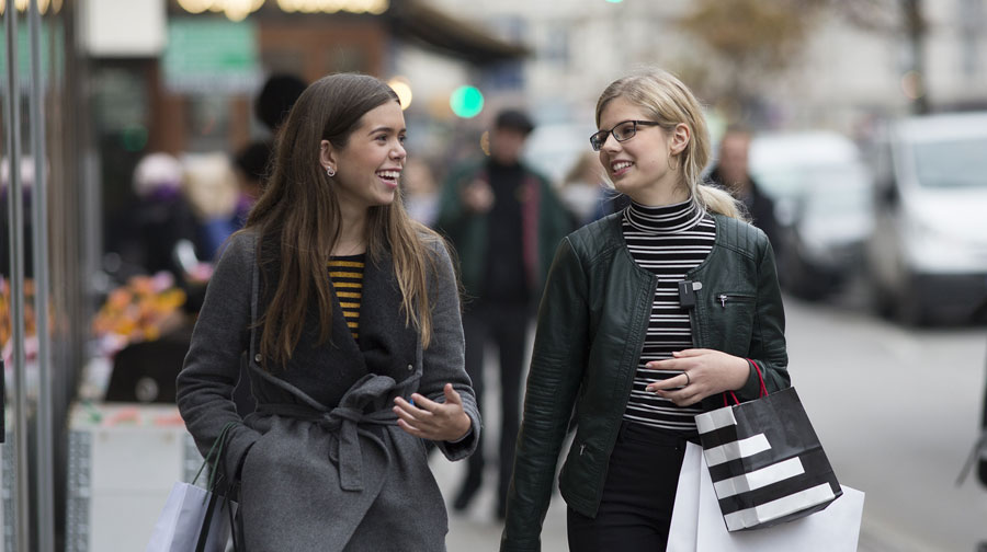 two teens walking down street with connectclip