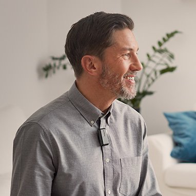  Man wearing ConnectClip hearing aid accessory