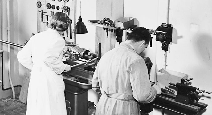 man and woman in a factory