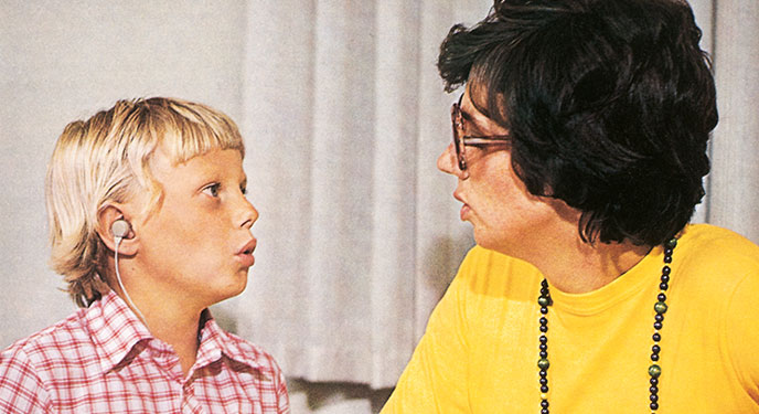 adult and child with hearing aids